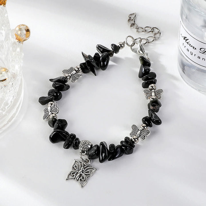Pulsera con dije de mariposa de escombros de cristal colorido de Olivenorma