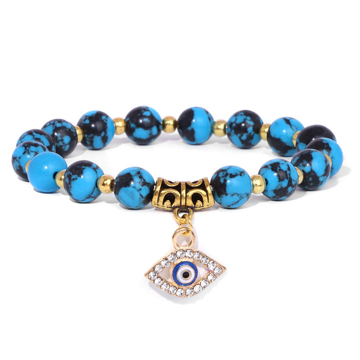 Pulsera con colgante de ojo malvado y cuentas de piedra natural de Olivenorma