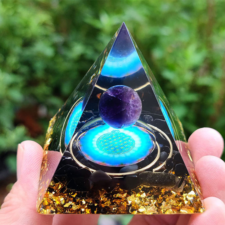 Esfera de cristal de amatista de Olivenorma con pirámide de orgón de obsidiana 