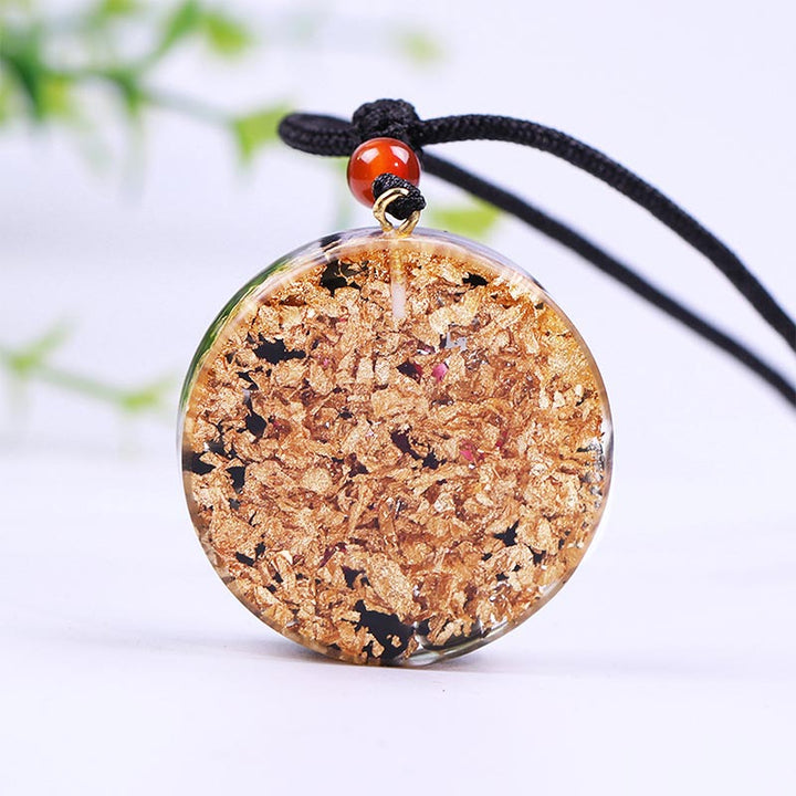Collar con símbolo del cubo de Metatrón en obsidiana y granate de Olivenorma 