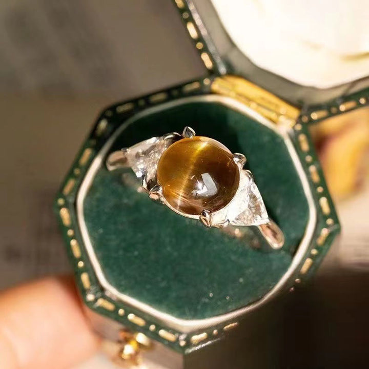 Anillo de piedra de ojo de gato verde dorado con cuatro garras de Olivenorma 