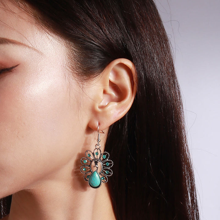 Pendientes colgantes en forma de pavo real con turmalina Paraiba y turquesa de Olivenorma