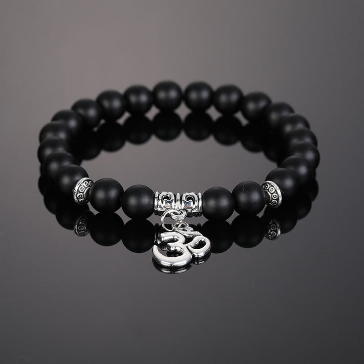 Pulsera con símbolo Om y cuentas de cristal natural de Olivenorma
