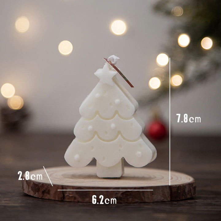 Vela perfumada con forma de hombrecito de jengibre y copos de nieve con atmósfera navideña de Olivenorma 