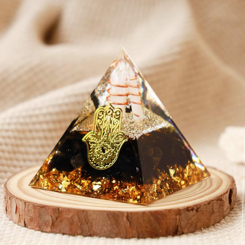 Pirámide de orgón de hamsa de obsidiana y cristal transparente de Olivenorma 