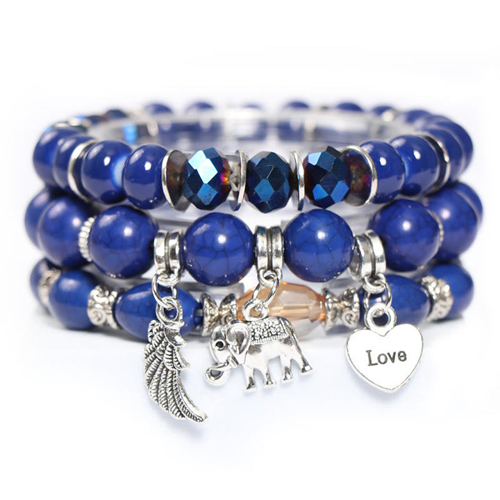 Juego de pulseras con cuentas y colgante de corazón con alas de elefante de Olivenorma 