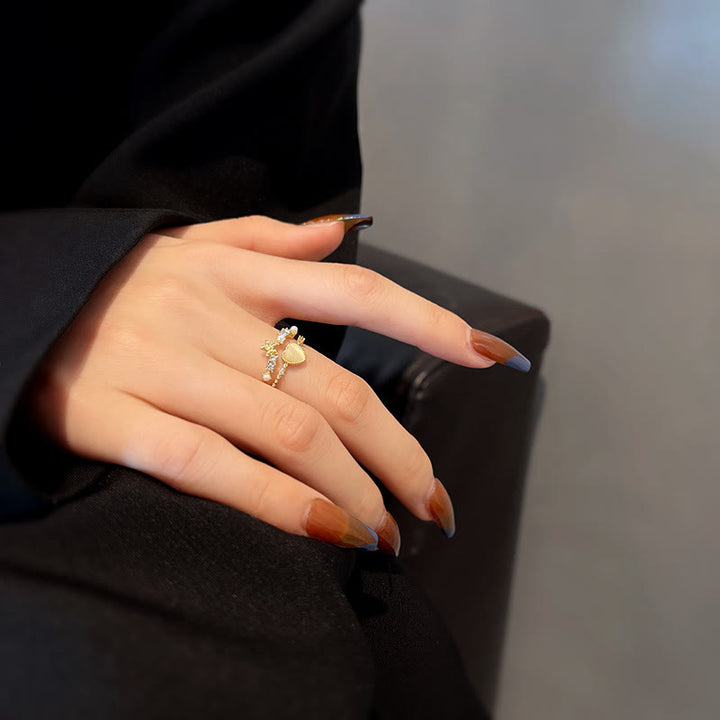 Anillo ajustable con piedra de ojo de gato y circonita blanca de Olivenorma 