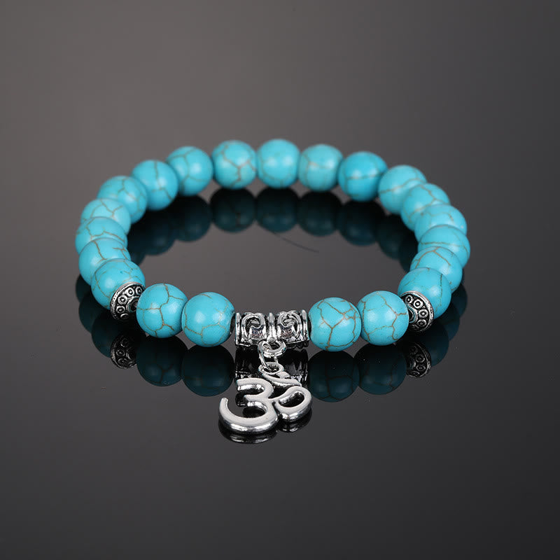Pulsera con símbolo Om y cuentas de cristal natural de Olivenorma