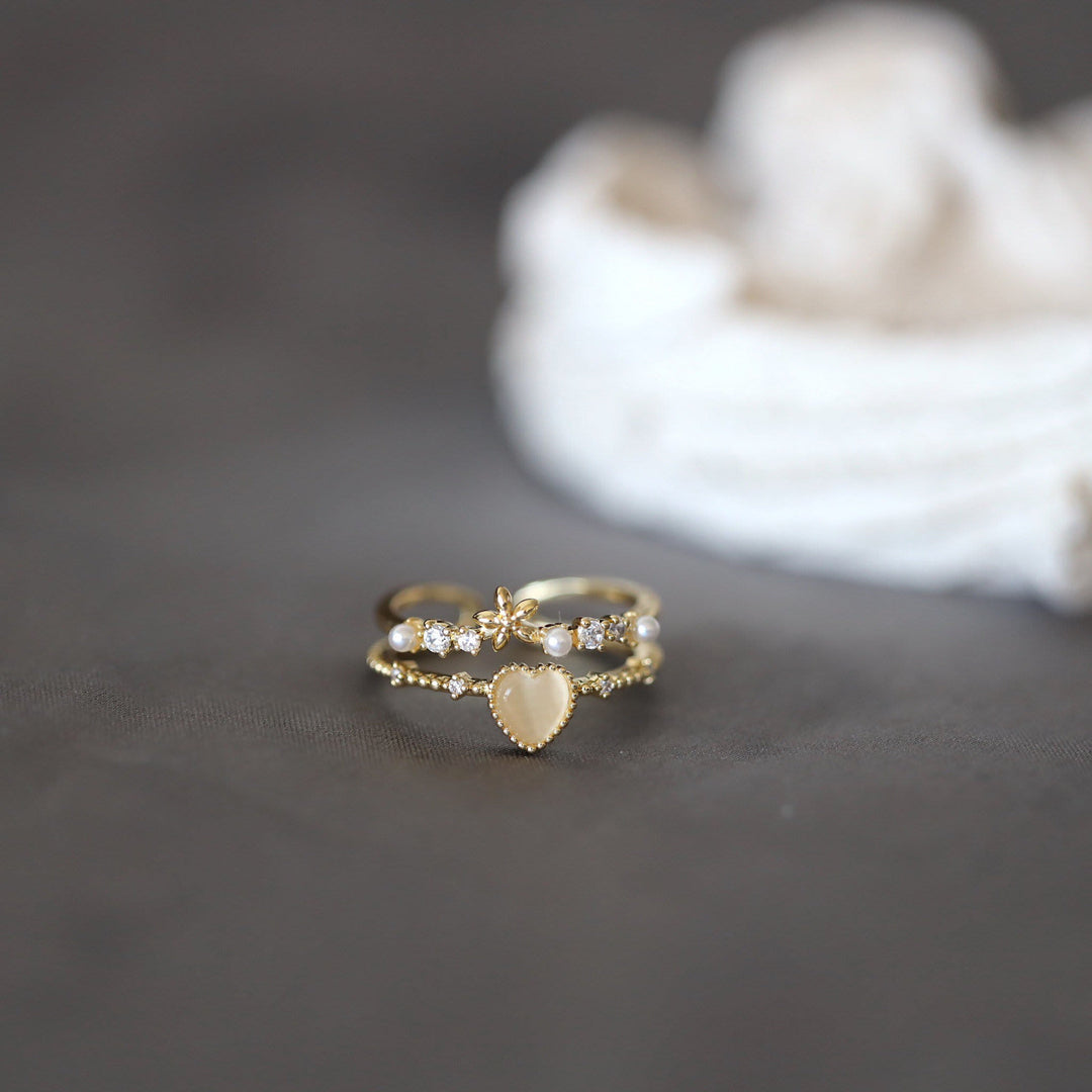 Anillo ajustable con piedra de ojo de gato y circonita blanca de Olivenorma 
