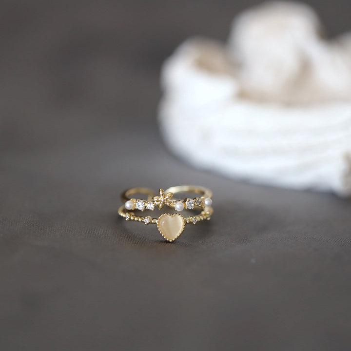 Anillo ajustable con piedra de ojo de gato y circonita blanca de Olivenorma 