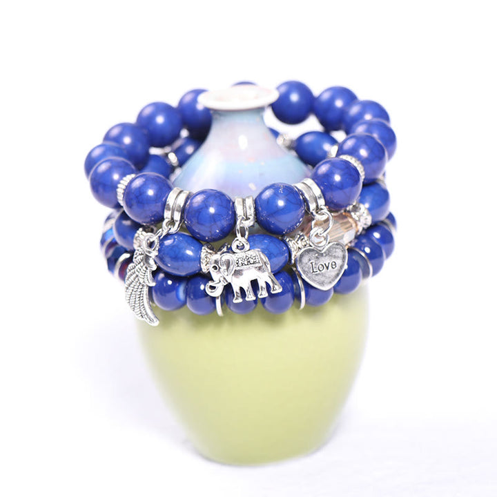 Juego de pulseras con cuentas y colgante de corazón con alas de elefante de Olivenorma 