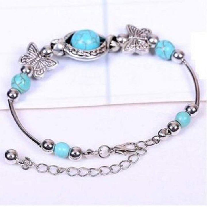 Pulsera de mariposa con esfera turquesa de Olivenorma