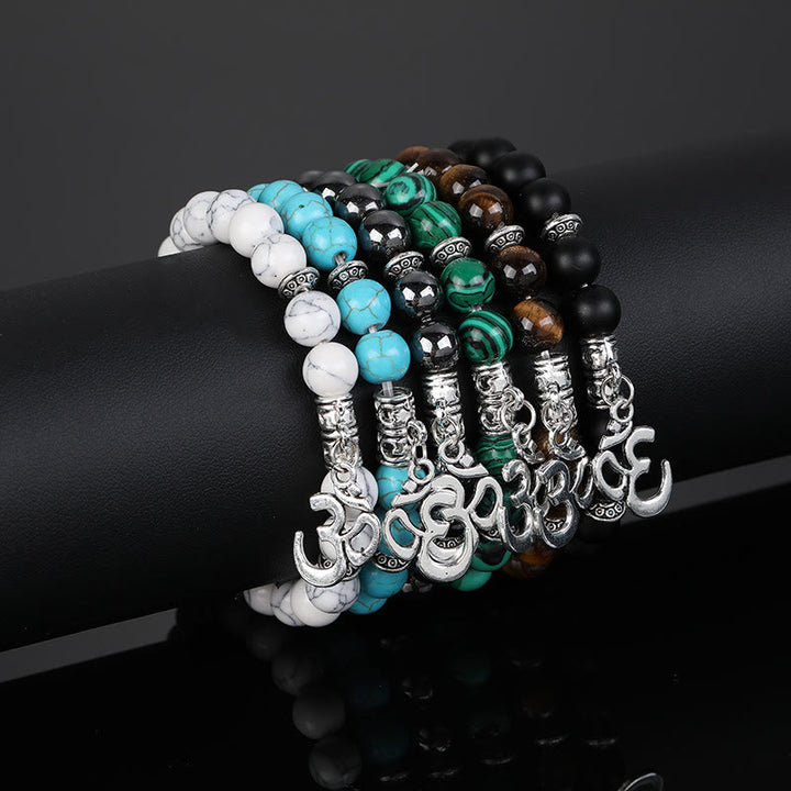 Pulsera con símbolo Om y cuentas de cristal natural de Olivenorma
