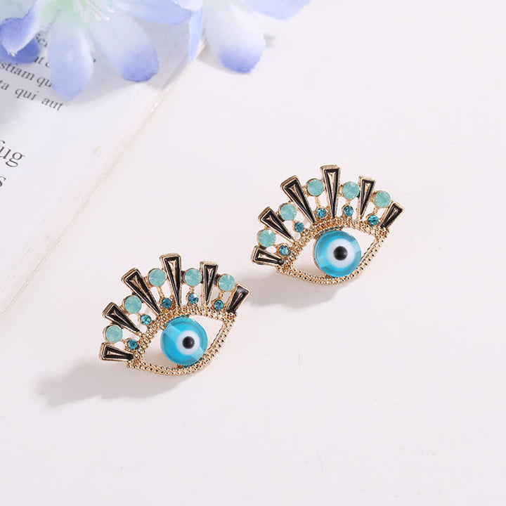 Pendientes creativos de pavo real con zafiro "Ojo de la perdición" de Olivenorma