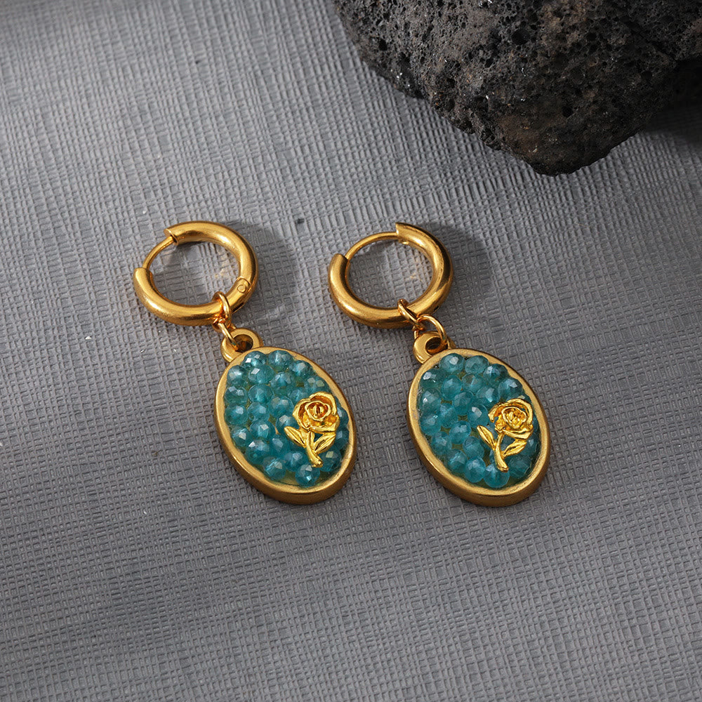 Pendientes colgantes ovalados con turmalina Paraiba y rosa triturada de Olivenorma