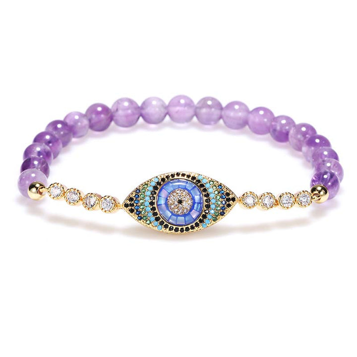 Pulsera curativa con símbolo del mal de ojo y amatista de Olivenorma 