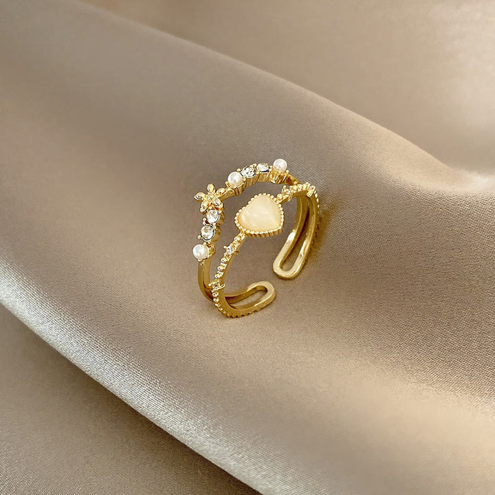 Anillo ajustable con piedra de ojo de gato y circonita blanca de Olivenorma 