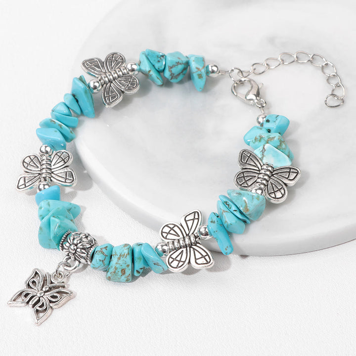 Pulsera con dije de mariposa de escombros de cristal colorido de Olivenorma