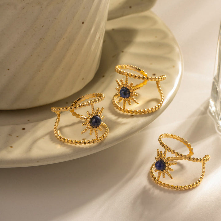 Anillo de gemas con estrella de ocho puntas y doble hilera de girasol de Olivenorma