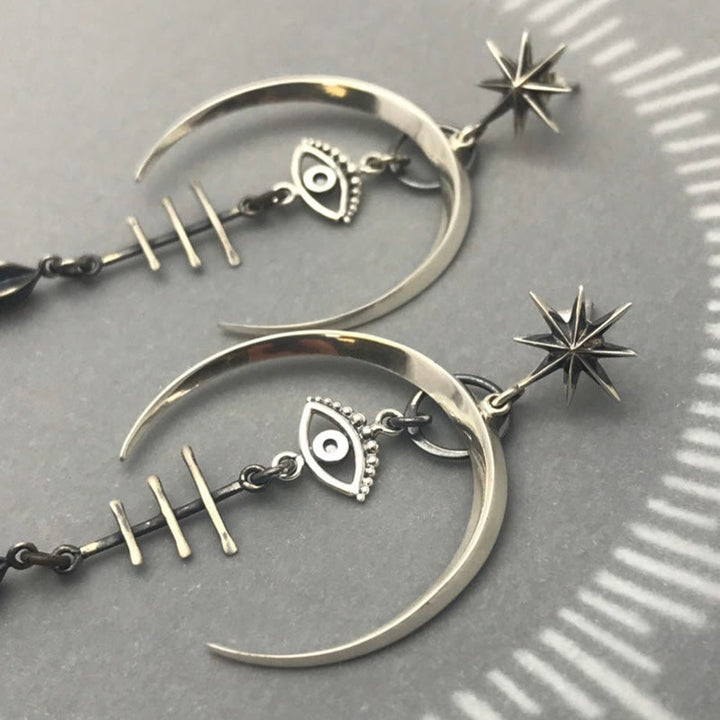 Pendientes de media luna con forma de ojo malvado de Olivenorma